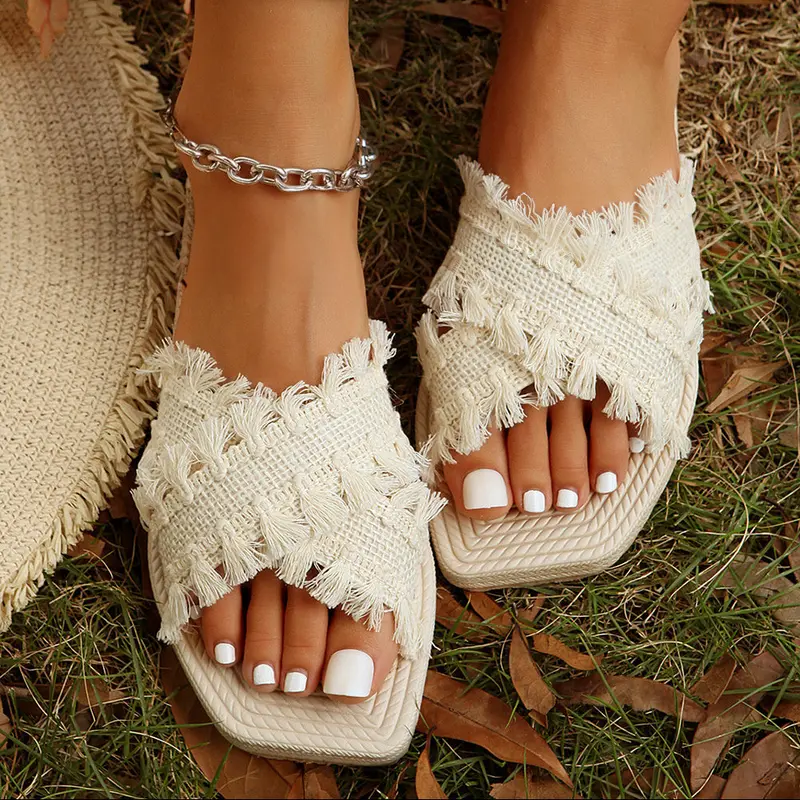 Vada Woven Tassel Flat Slippers