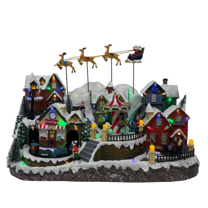 Villaggio natalizio con slitta di Babbo Natale e renne