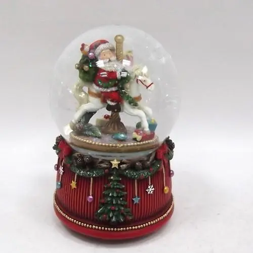 Waterball con Musica 100MM Babbo Natale su Cavallino a Dondolo